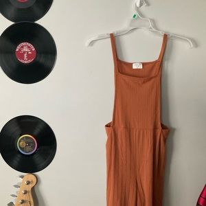 Sienna sky gently worn burnt orange/tan colored jumpsuit